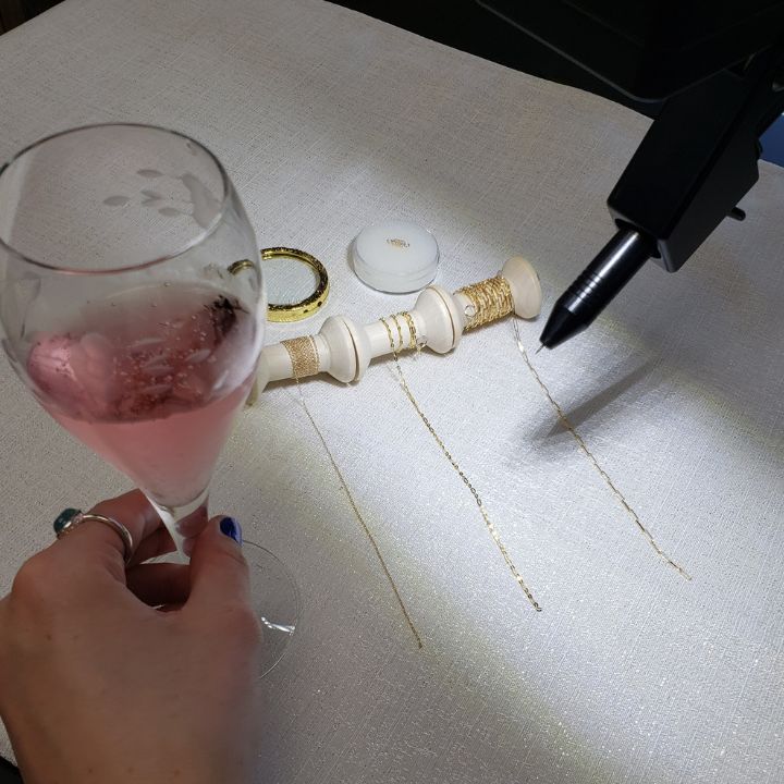 Permanent jewelry bracelet being welded at Lux Jewelry lounge in Bellevue