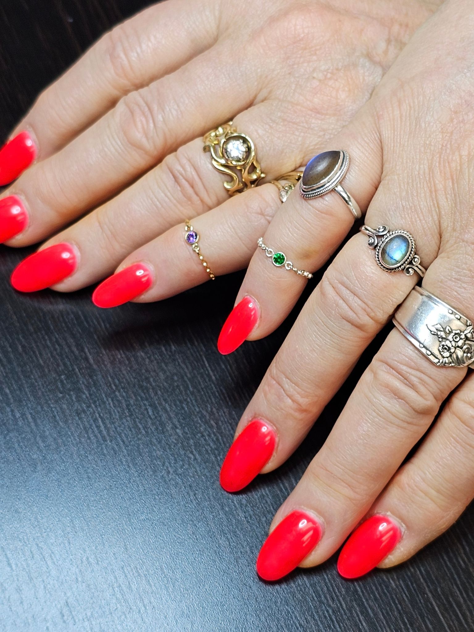 Permanent jewelry chain rings worn on fingers at Lux Jewelry Lounge in Bellevue